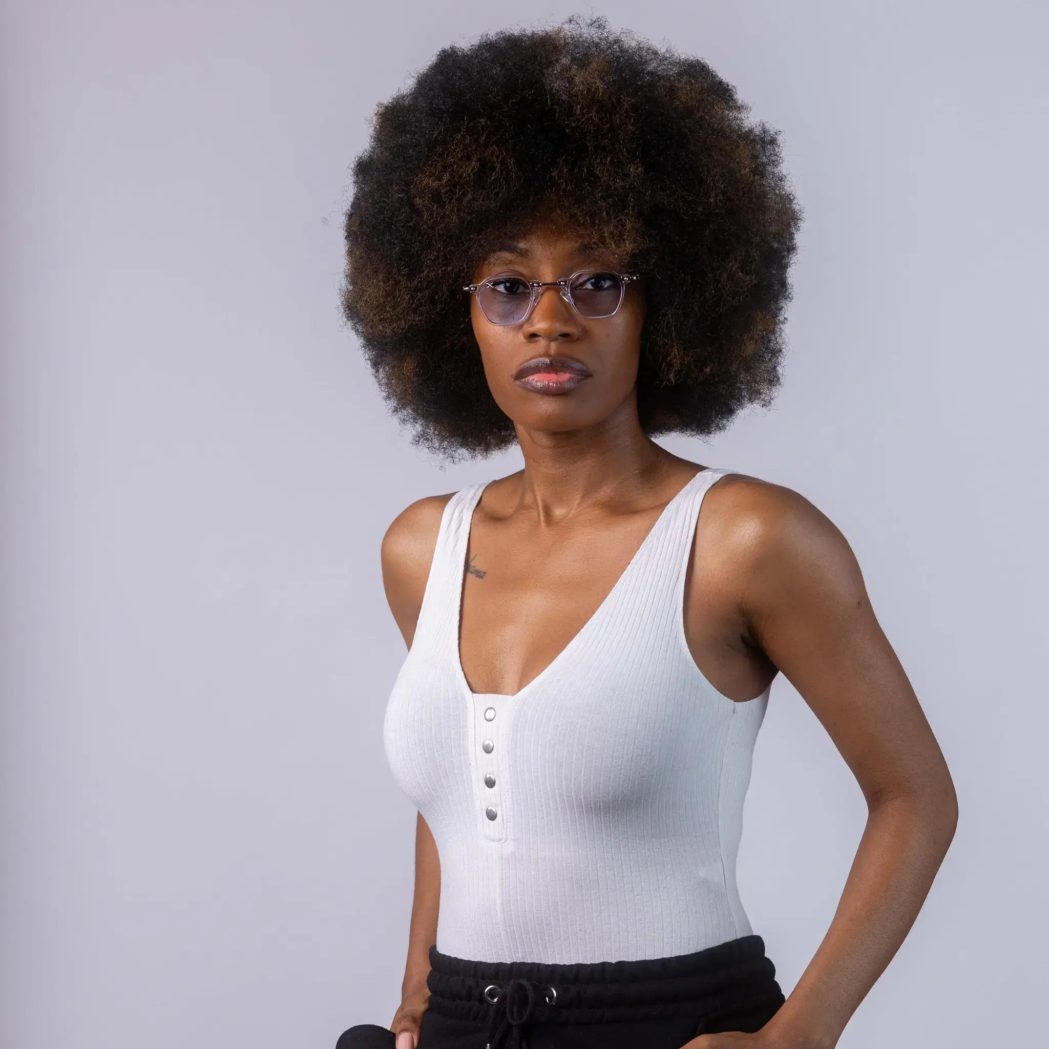 A female model wearing Exposure Sunglasses polarized sunglasses with white frames and blue lenses, posing against a white background.