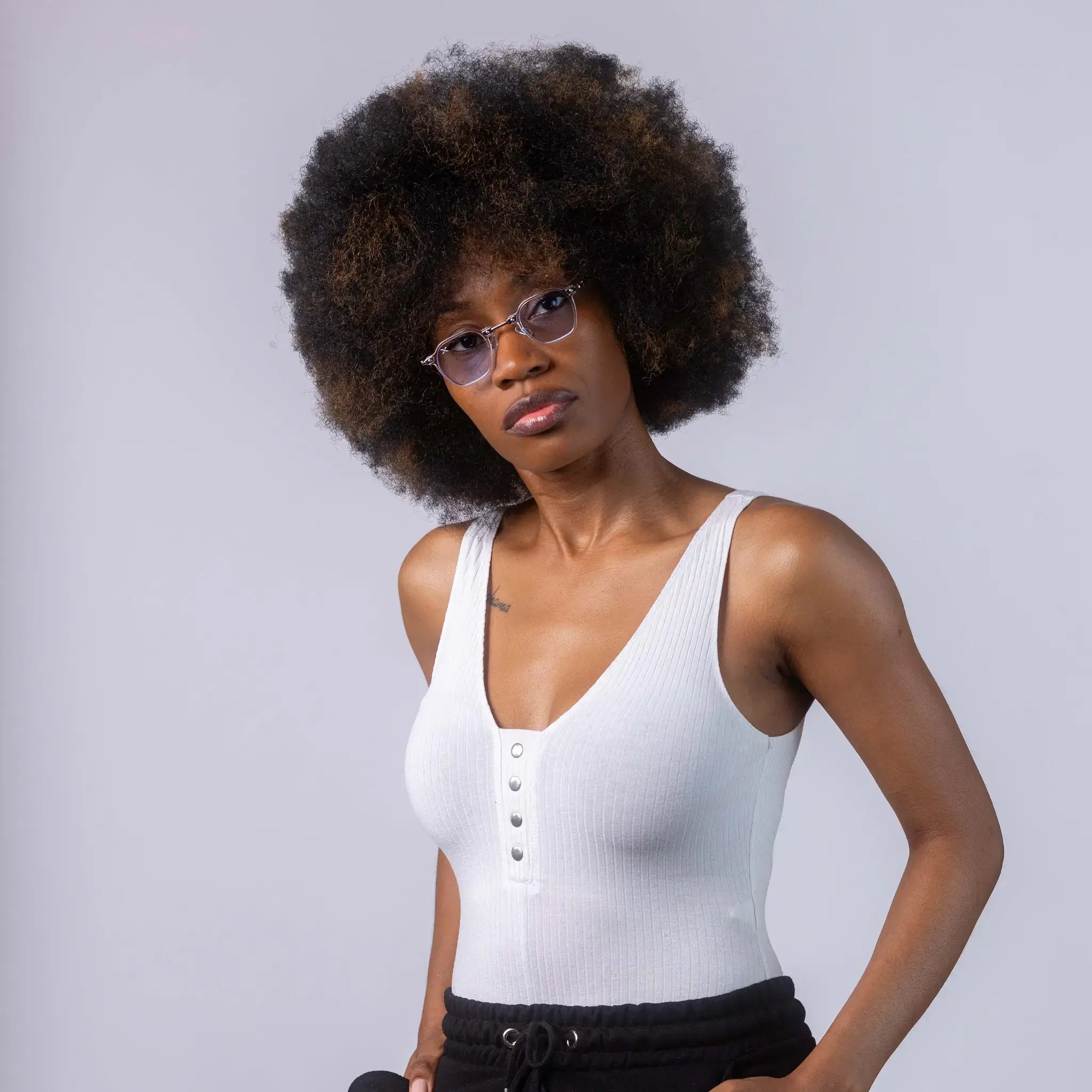 A female model wearing Exposure Sunglasses polarized sunglasses with white frames and blue lenses, posing against a white background.