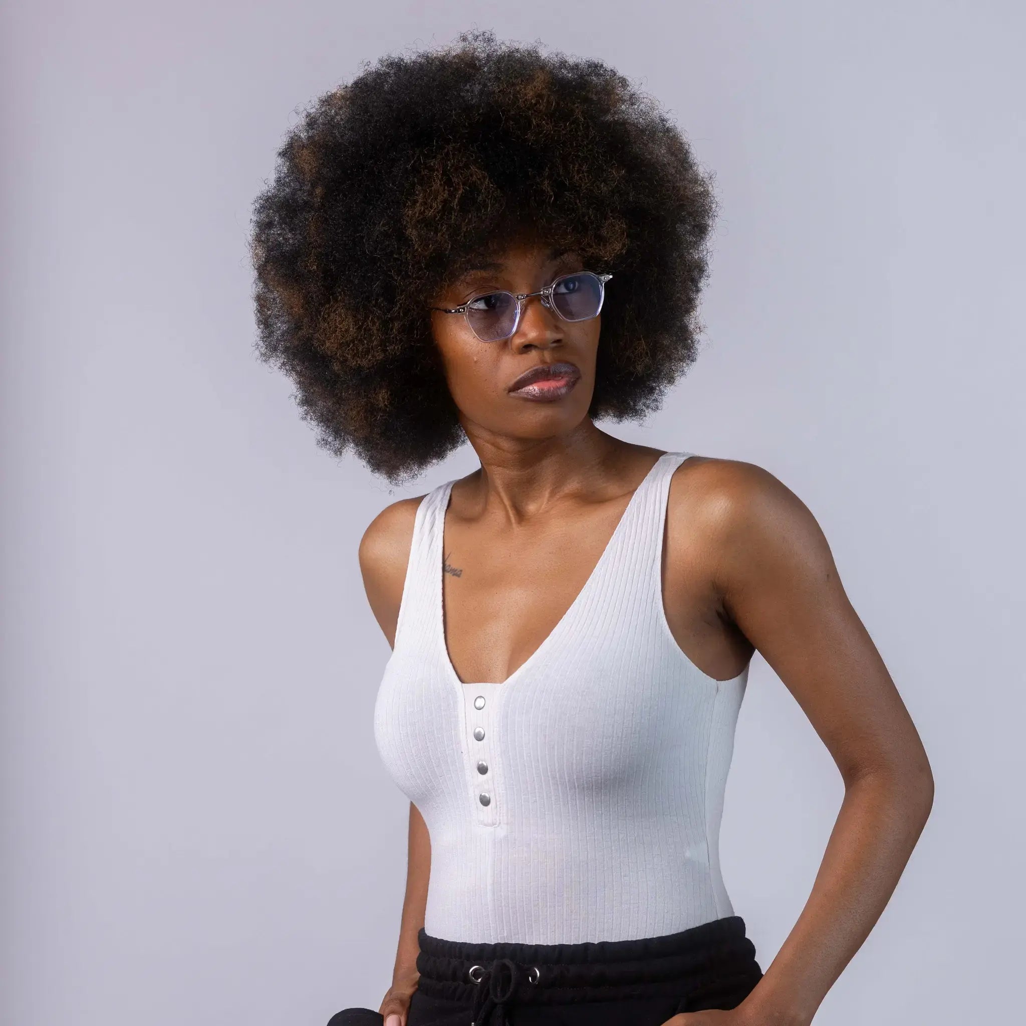 A female model wearing Exposure Sunglasses polarized sunglasses with white frames and blue lenses, posing against a white background.