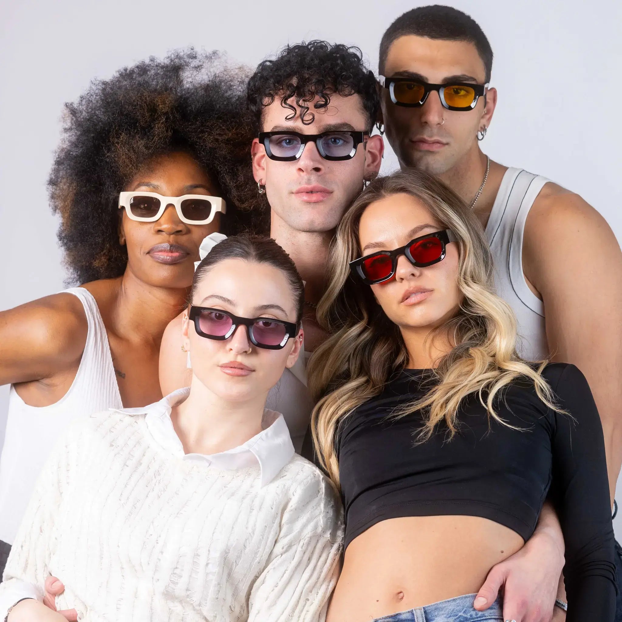 Five models wearing Exposure Sunglasses polarized sunglasses with black frames and tinted lenses, posing against a white background.