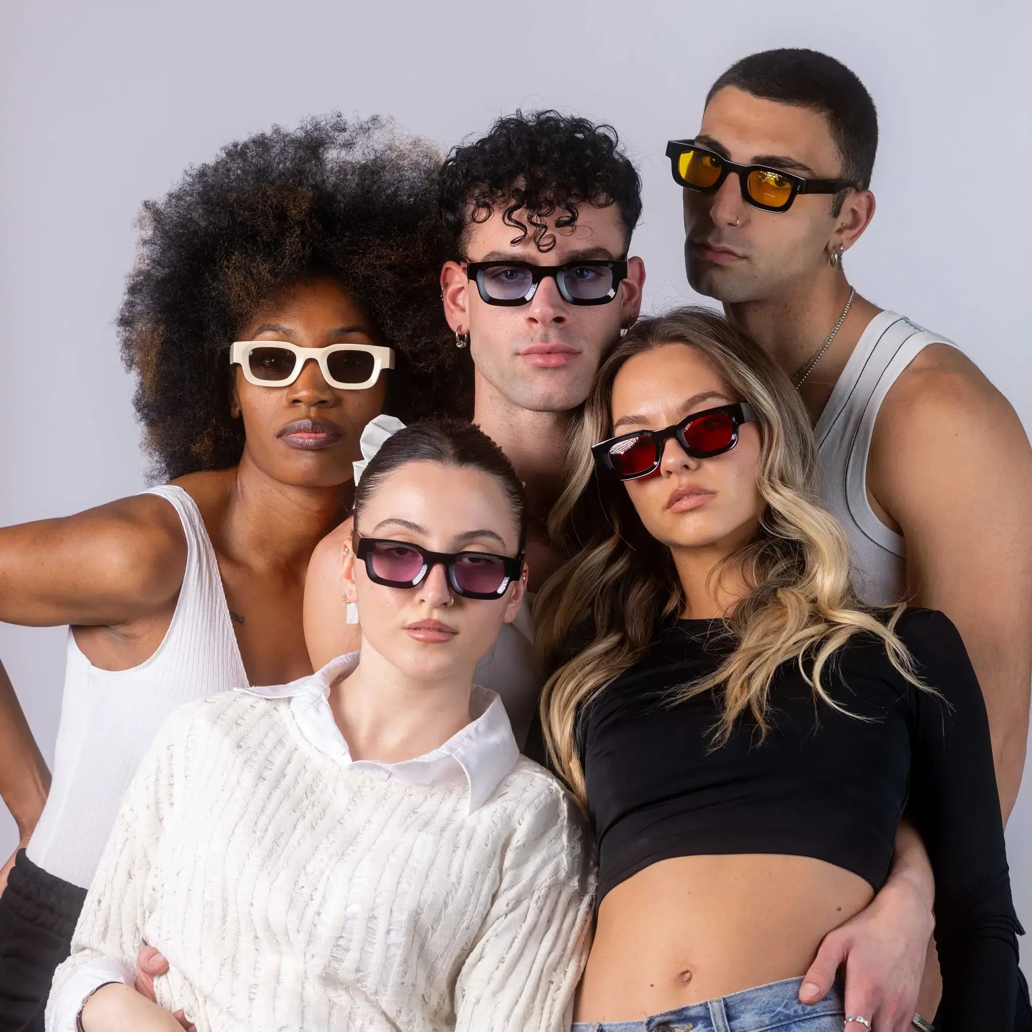 Five models wearing Exposure Sunglasses polarized sunglasses with black frames and tinted lenses, posing against a white background.