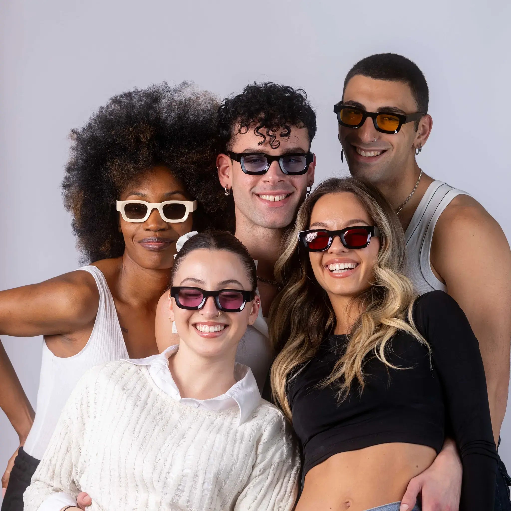 Five models wearing Exposure Sunglasses polarized sunglasses with black frames and tinted lenses, posing against a white background.