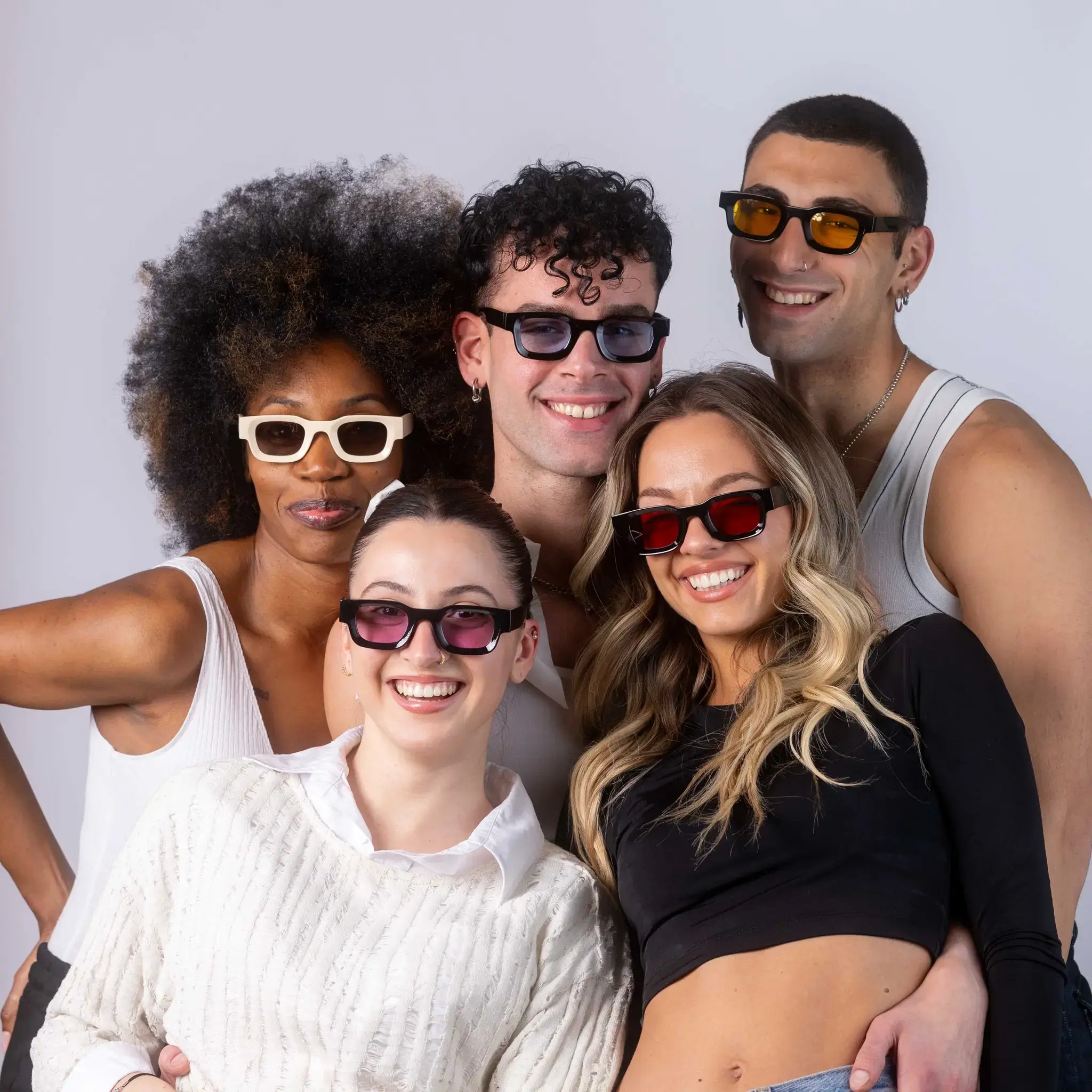 Five models wearing Exposure Sunglasses polarized sunglasses with black frames and tinted lenses, posing against a white background.