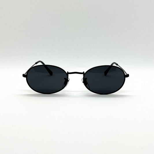 Οβάλ Γυαλιά ηλίου Chemi της Exposure Sunglasses με προστασία UV400 με μαύρο σκελετό και μαύρο φακό.